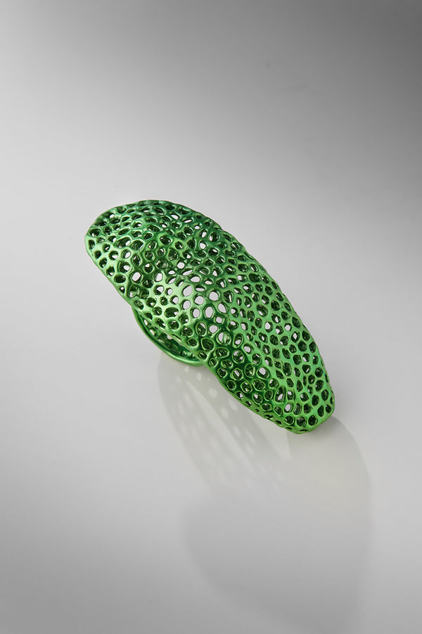 Green textured ring on a gray background